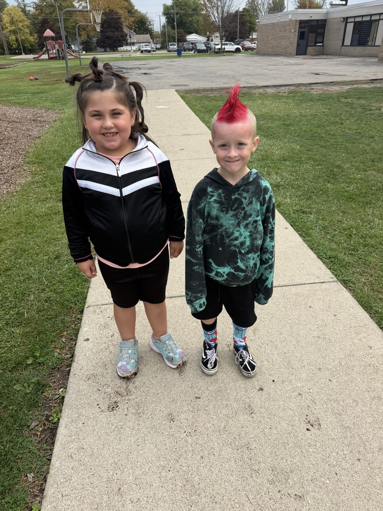 Students showing off their crazy hairstyles and fun socks for Spirit Week.
