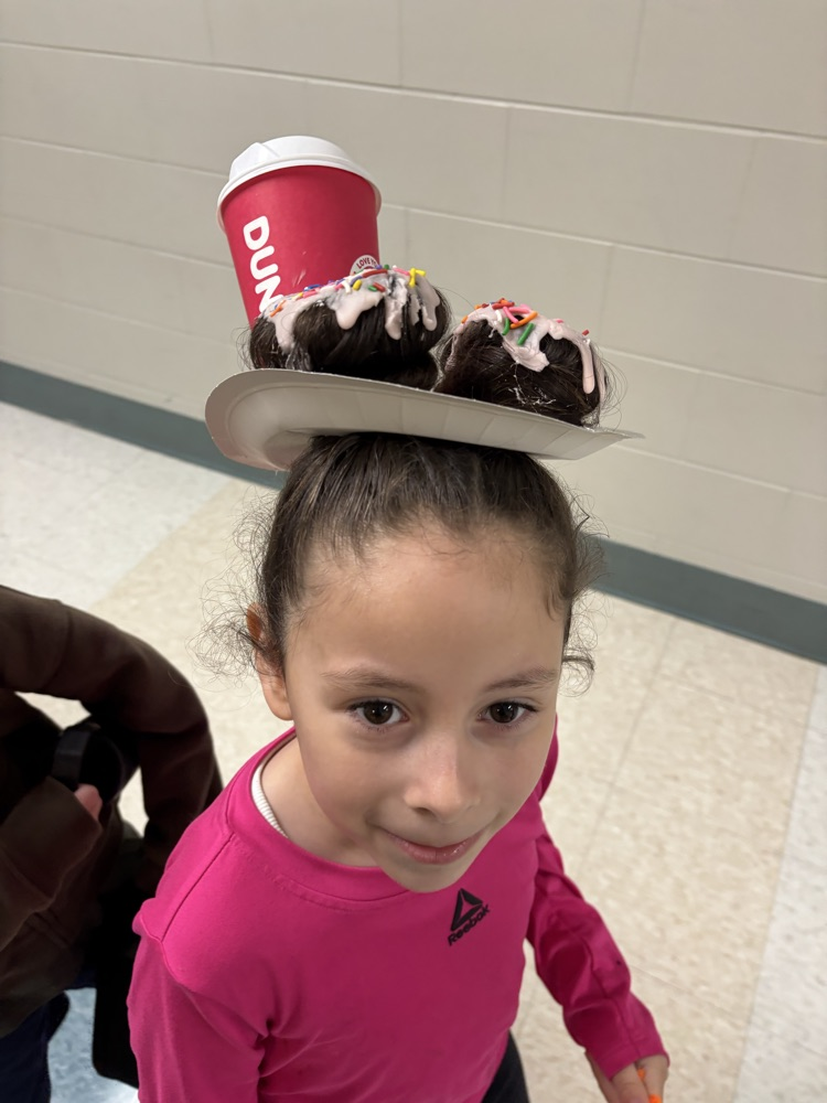 Students showing off their crazy hairstyles and fun socks for Spirit Week.