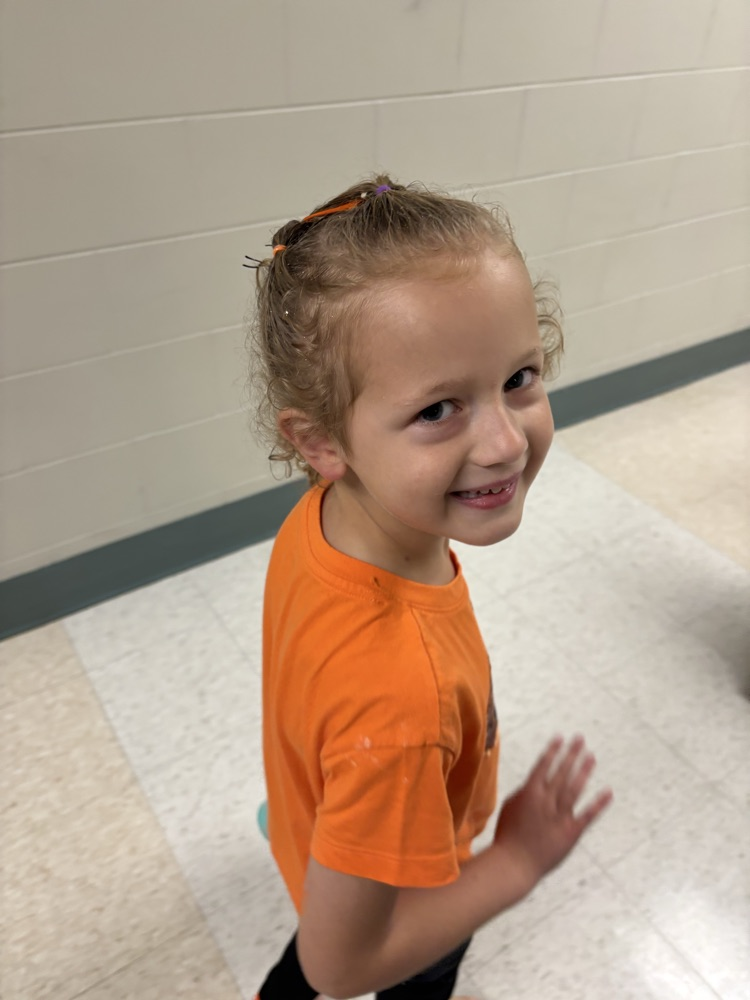 Students showing off their crazy hairstyles and fun socks for Spirit Week.