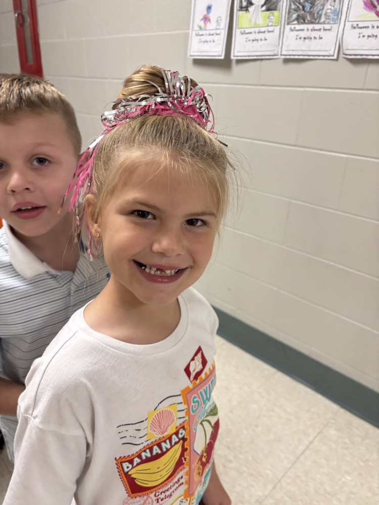 Students showing off their crazy hairstyles and fun socks for Spirit Week.