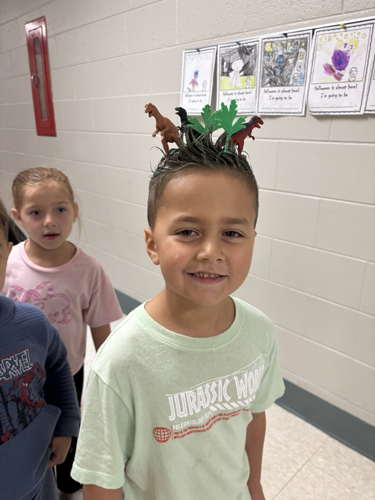 Students showing off their crazy hairstyles and fun socks for Spirit Week.