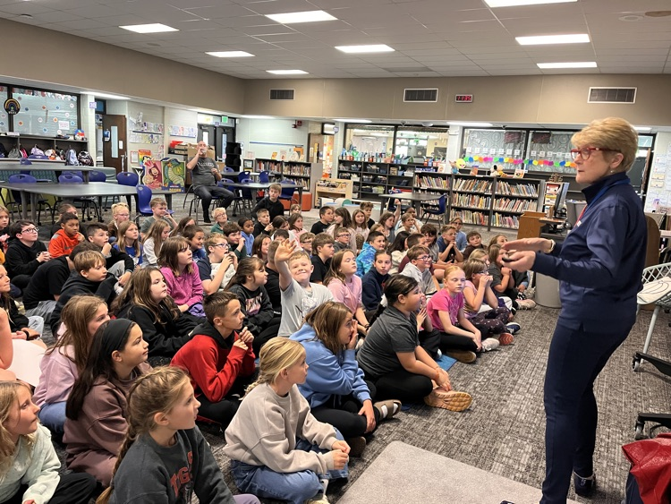 4th graders learning about energy during DTE presentation in library 