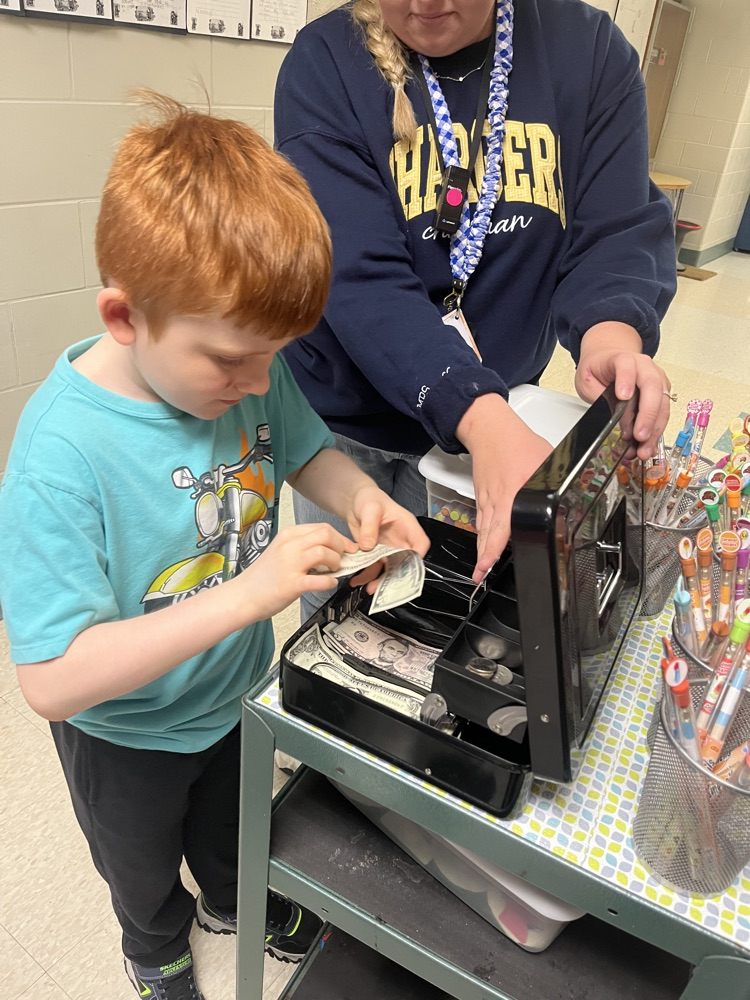 Alt text: Chapman students shop for colorful, scented Smencils from a classroom cart during the Peer to Peer Program’s Smencil Sale.