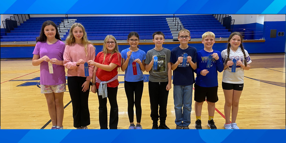 Literacy fair winner, all in a row with their ribbons