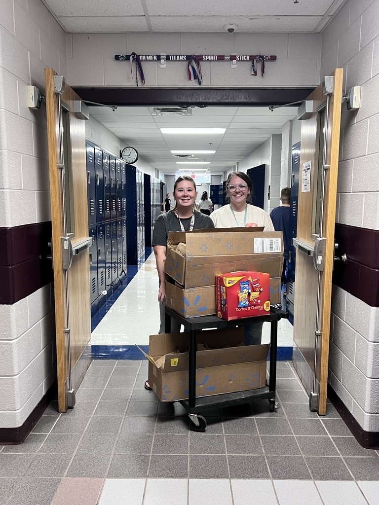 Mrs. Workman and Mrs. Sponaugle delivering popcorn