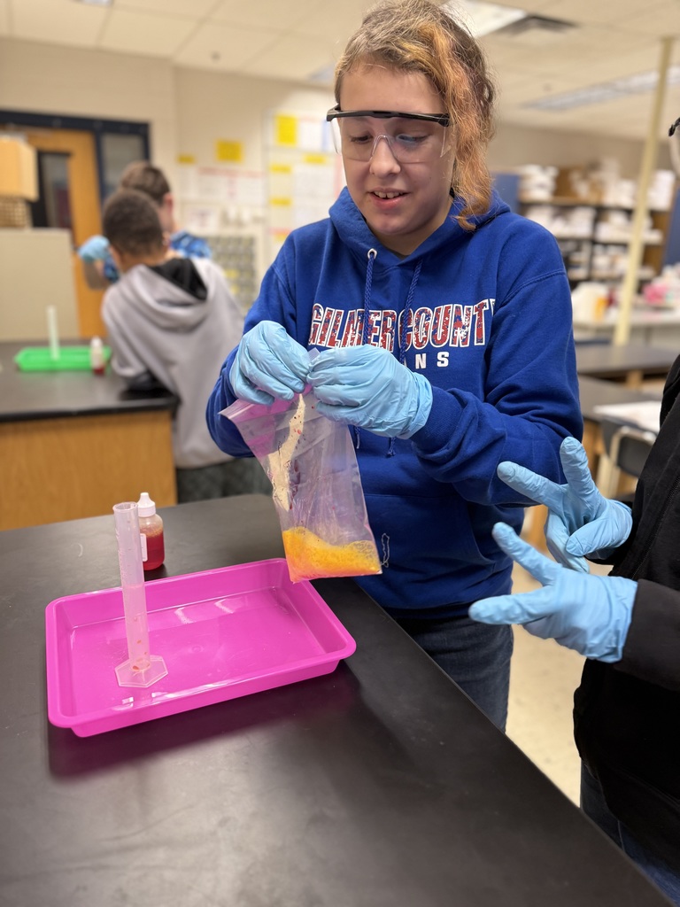 a student holds a plastic bag