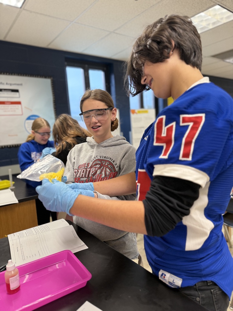 two students with their materials