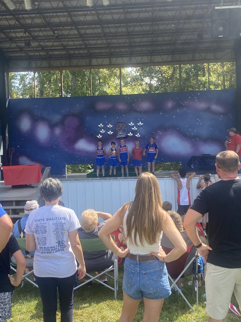 2nd place finish for middle school. on stage receiving medals