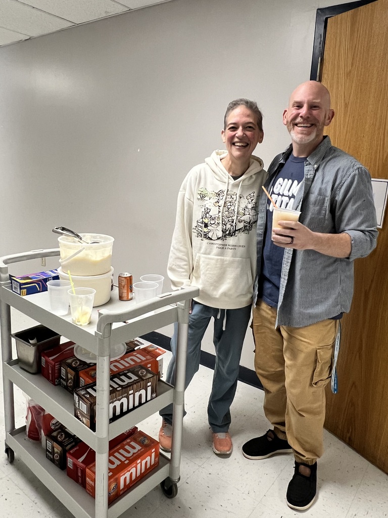Mrs. Barr and Mr. B. Fisher with a cart of soda and ice cream.