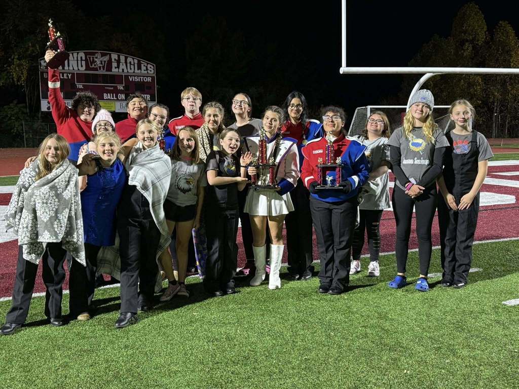 GCHS Band posing with trophies