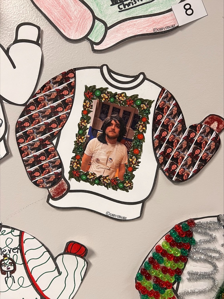various ugly sweaters on the wall
