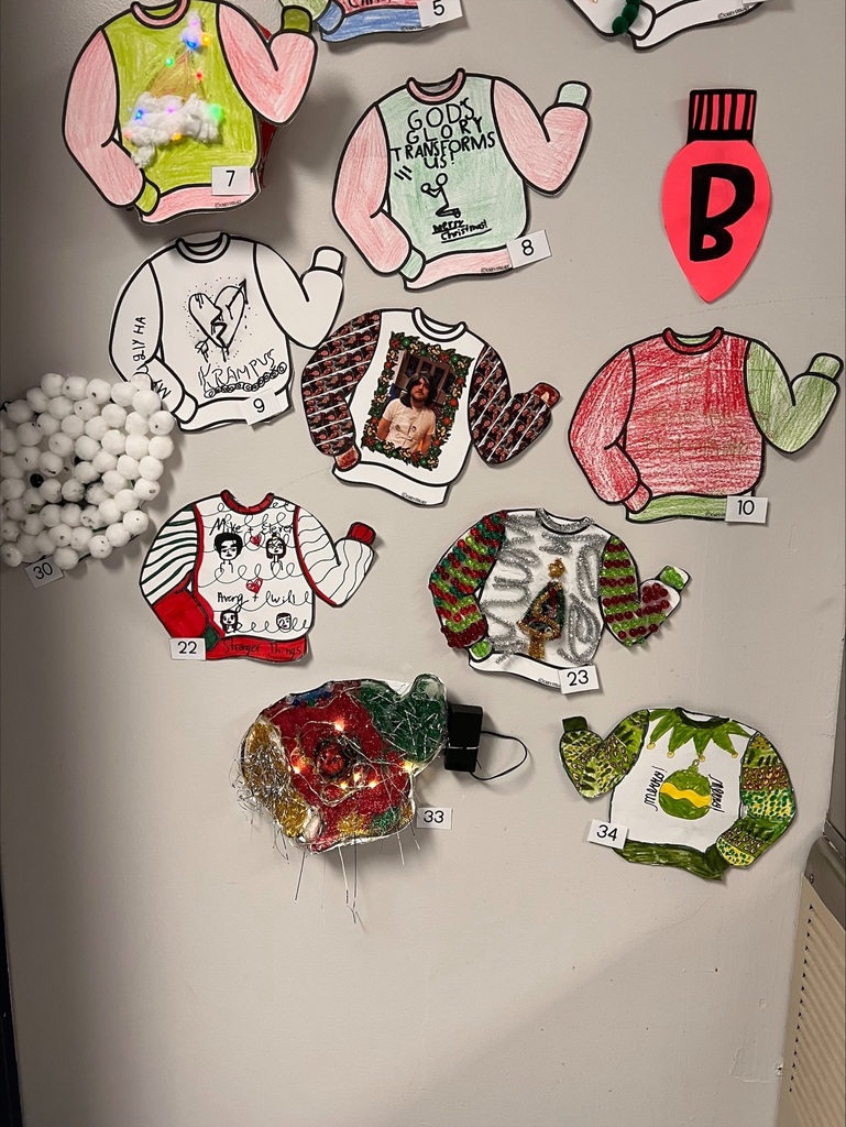 various ugly sweaters on the wall