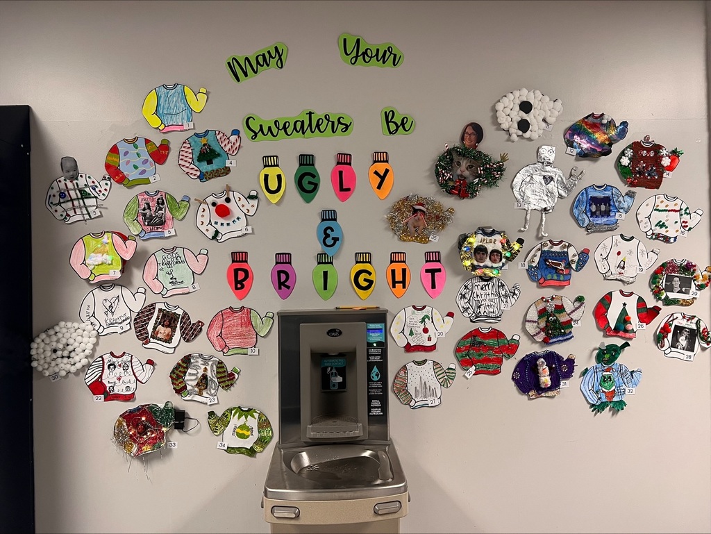 various ugly sweaters on the wall