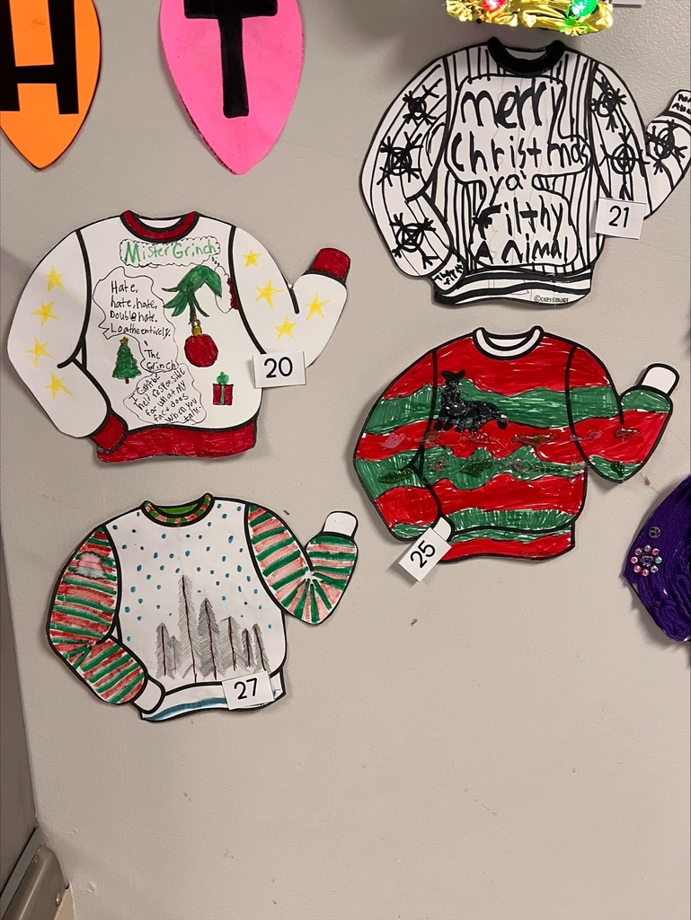 various ugly sweaters on the wall