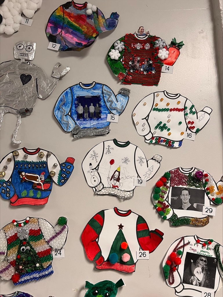 various ugly sweaters on the wall
