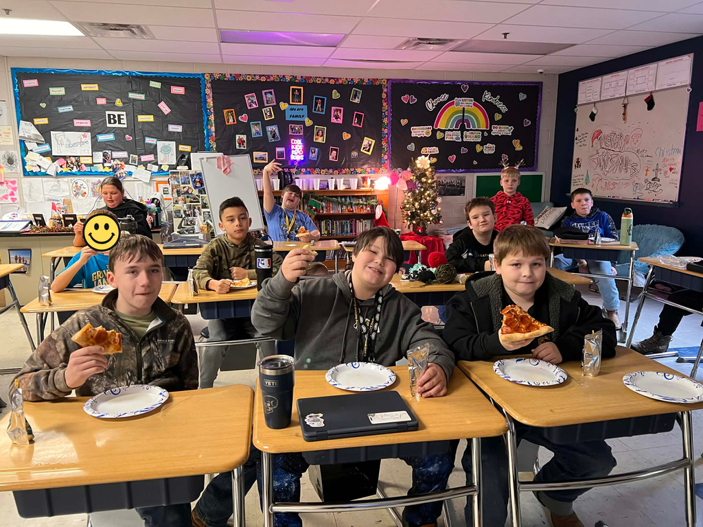Mrs. Facemire's homeroom enjoying slices of pizza