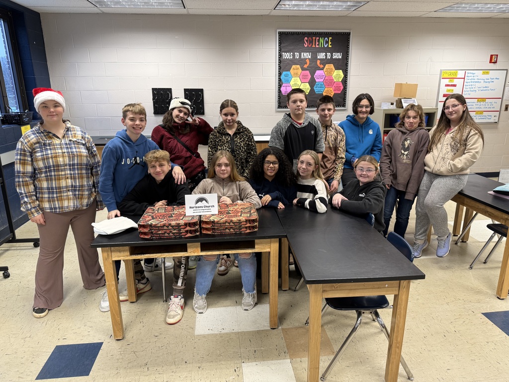 Mrs. Ramezan's homeroom posting with pizza