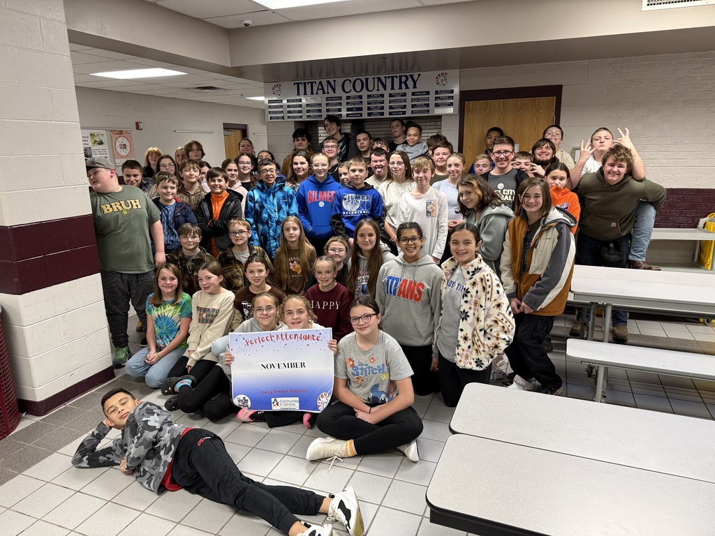 Perfect Attendance Students posing in the school commons area 