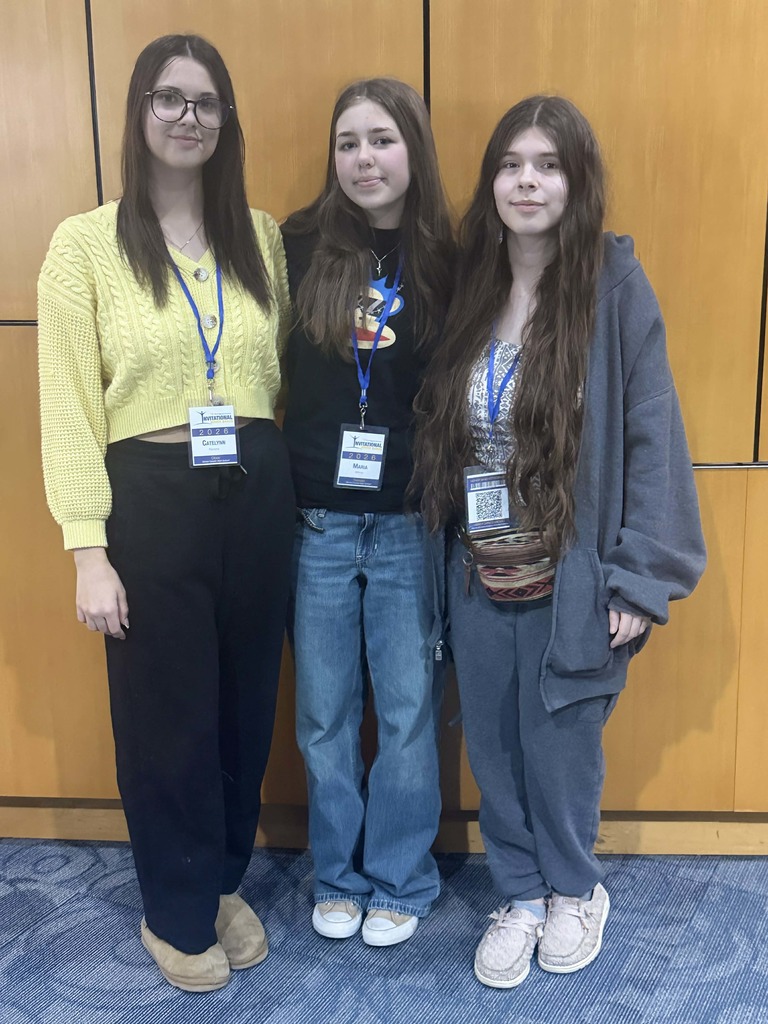 Katie, MAria, and Marelly with lanyards on 