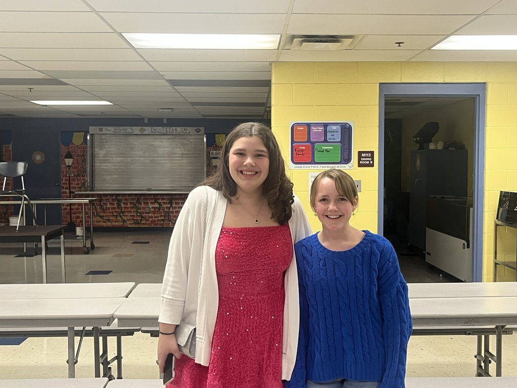 Two students standing in the Cafe