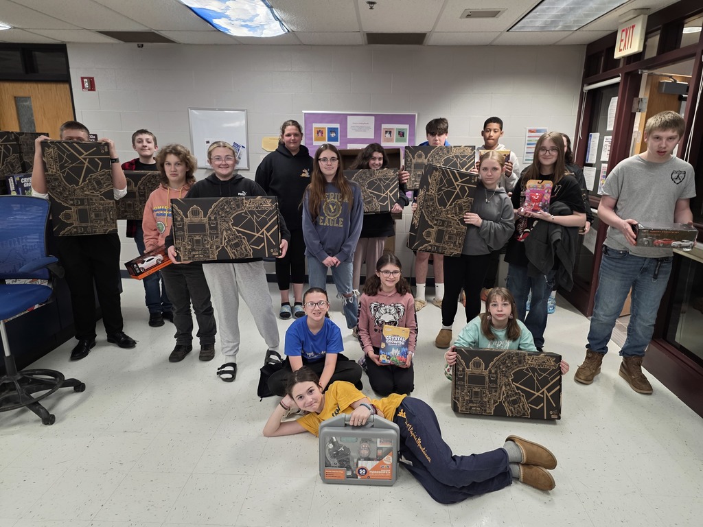 steam fair winners holding prizes, middle schoolers