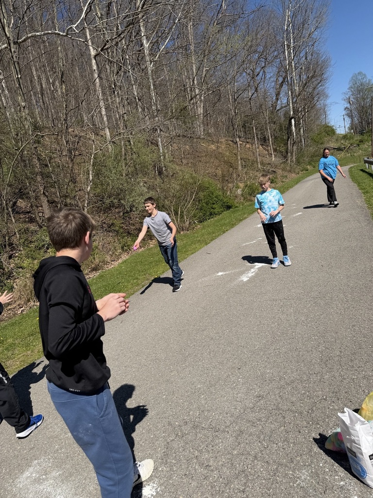 egg in mid air between two students