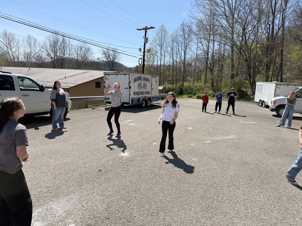 students standing in the parking lot, ready to toss eggs