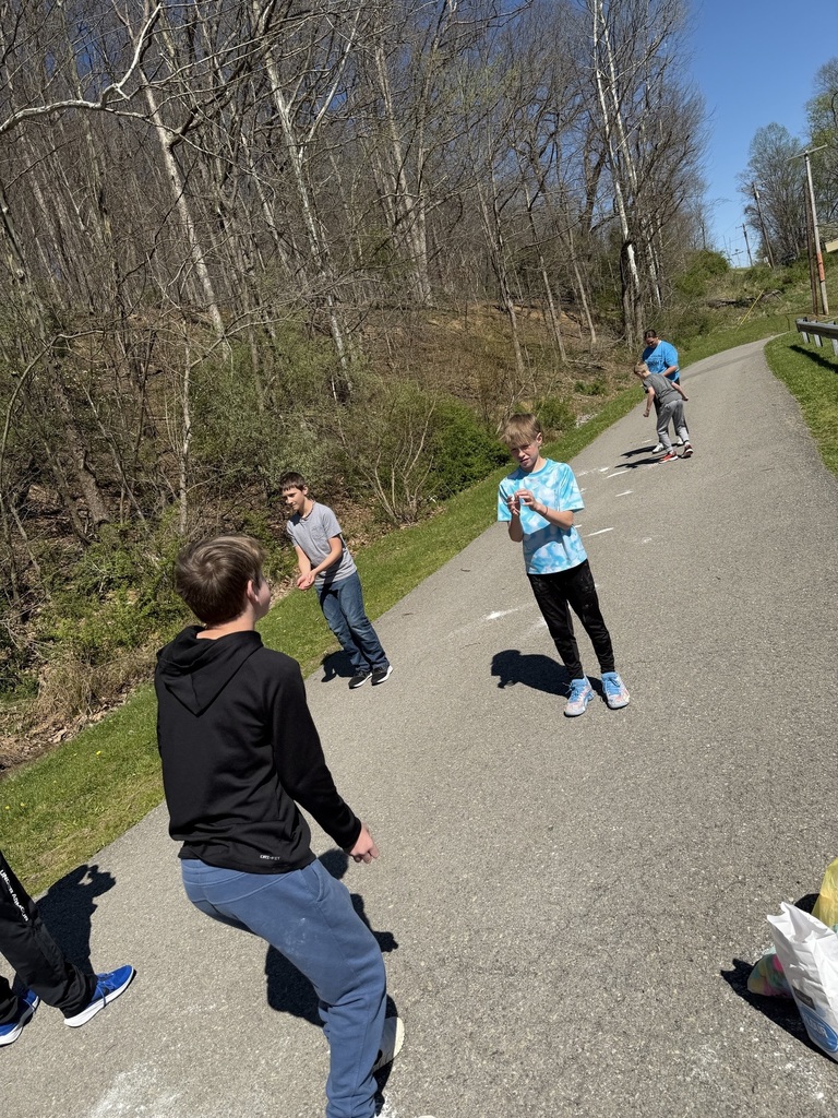 egg in mid air between two students
