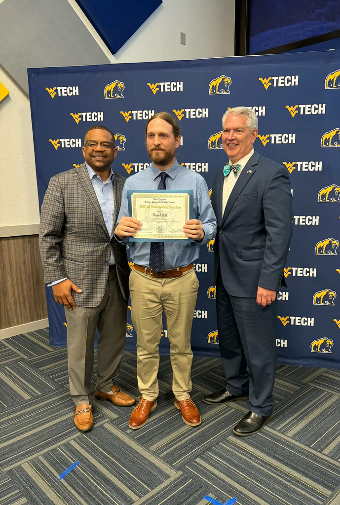 Mr. Hill receiving a certificate