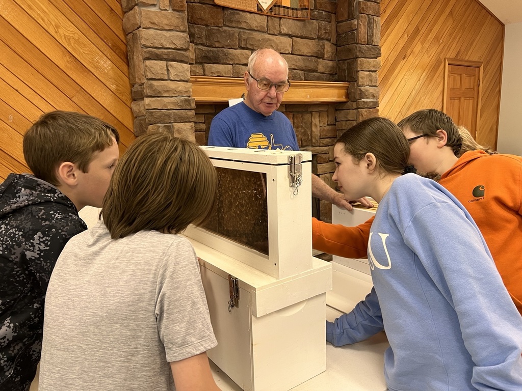 students learning about beekeeping