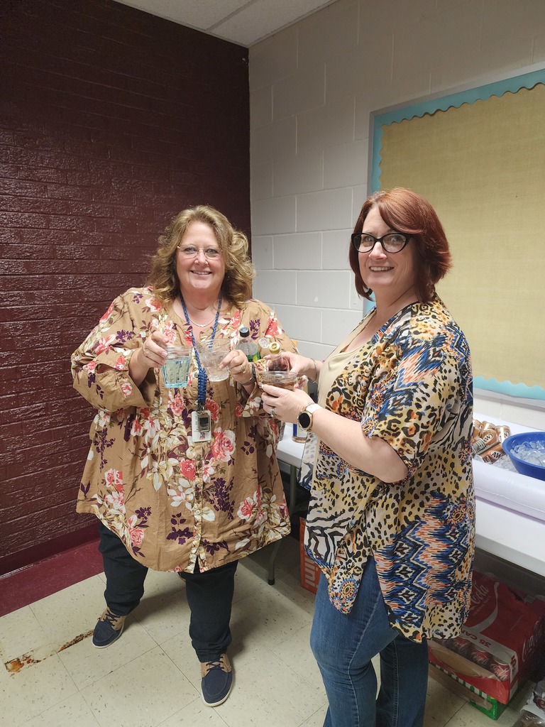 mrs. montgomery and mrs facemire posing with sodas