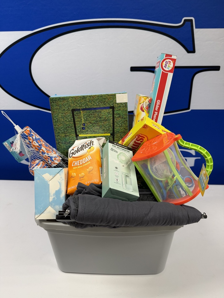 photo of assorted items as a prize. goldfish crackers, a notebook, and more