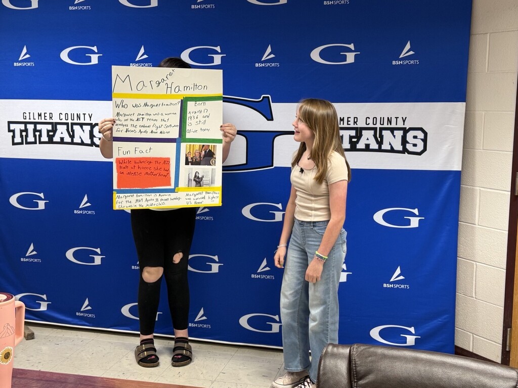 students with a poster about margaret hamilton