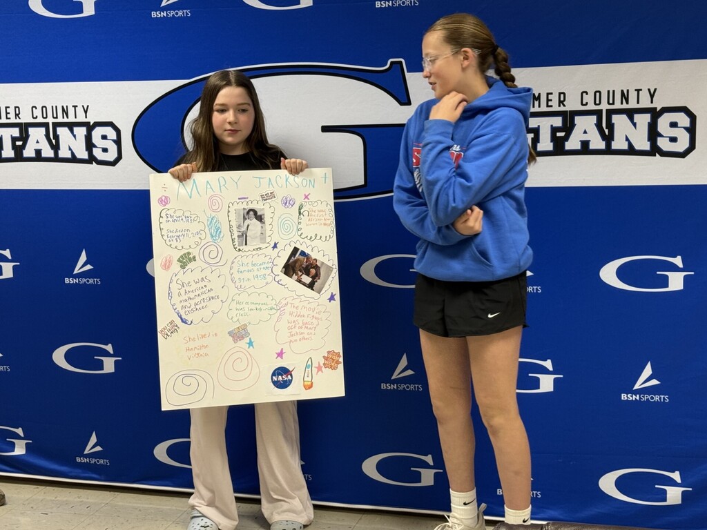 students with a poster about mary jackson