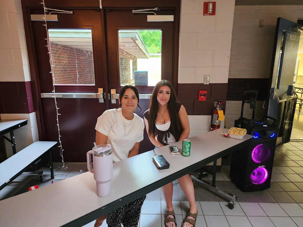 Student council officers DJ the dance
