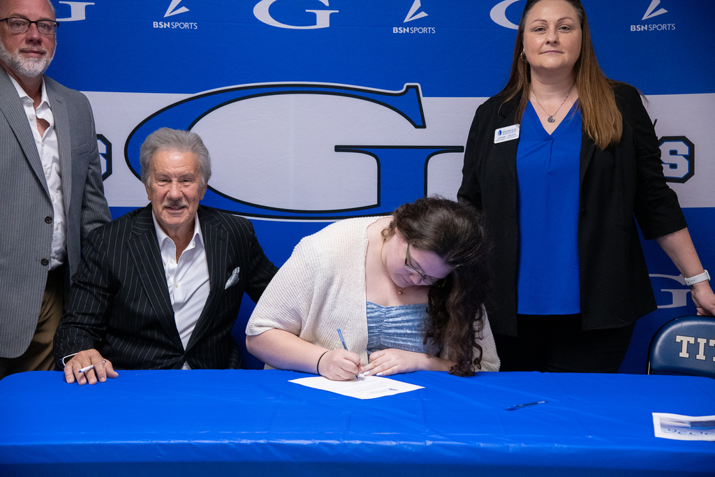 Bella Grijalva signing her intent for GSU -- Dr. Mark Manchin and others in the photo - tight shot