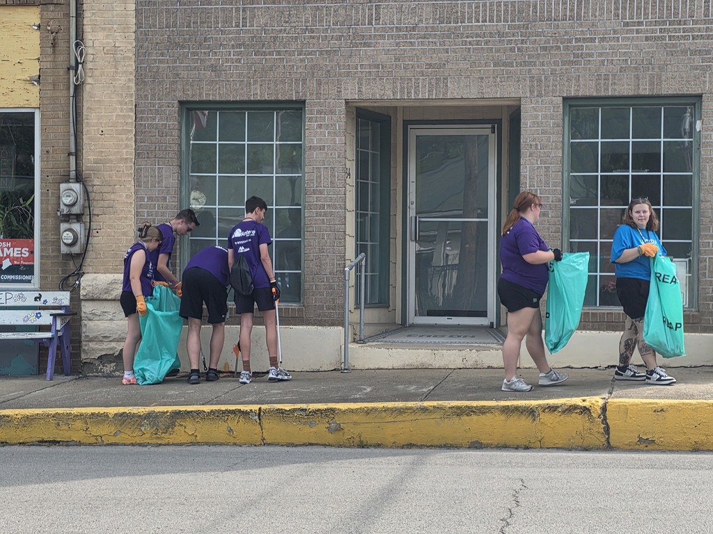 students cleaning up trash