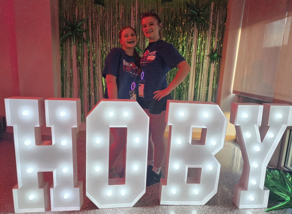 two students with hoby letters
