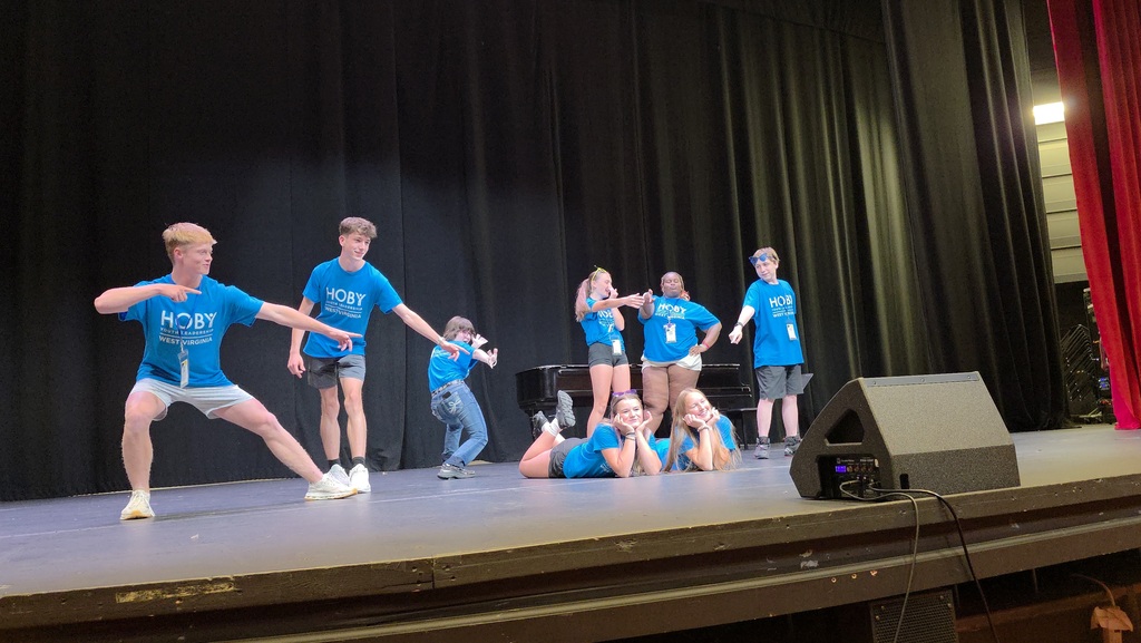 students standing on stage