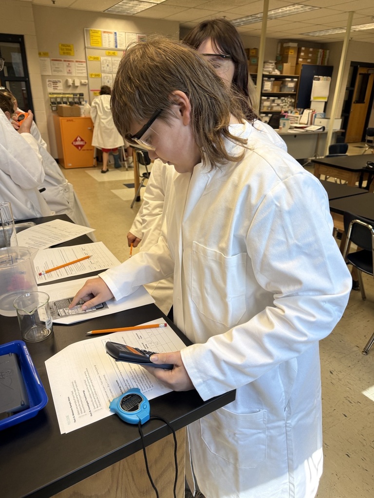 student filling out lab report