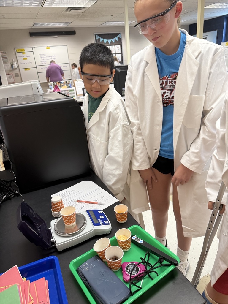 students weighing a specimen
