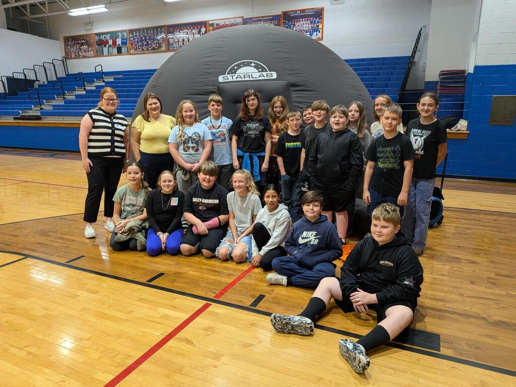 6th grade students in front of the starlab