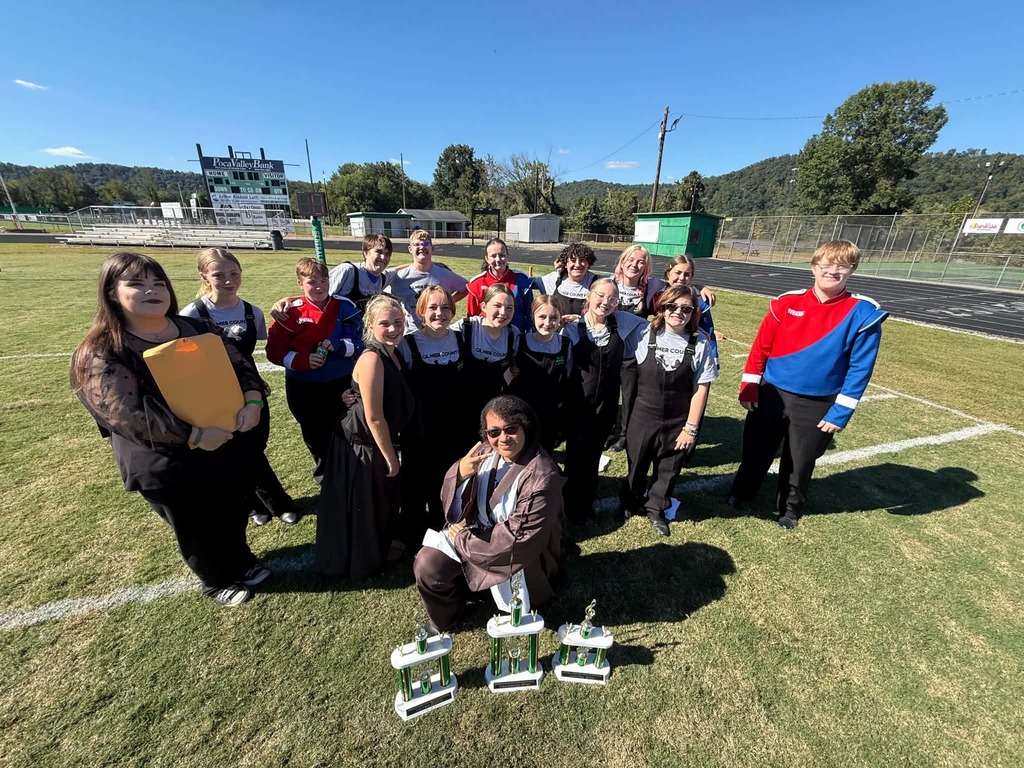 picture of students in gchs Marching Band posing with the trophies for Class d competition along with band director Mrs buckley