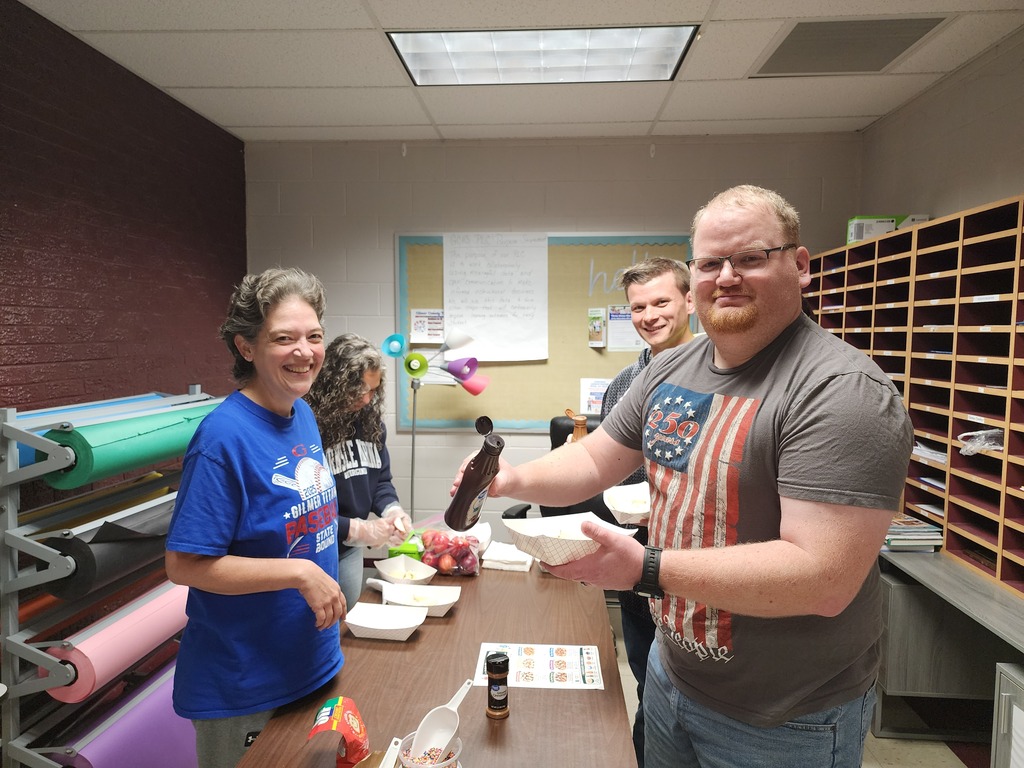 Mrs. barr and Mrs Smith making nachos for my yocum and Mr arthur