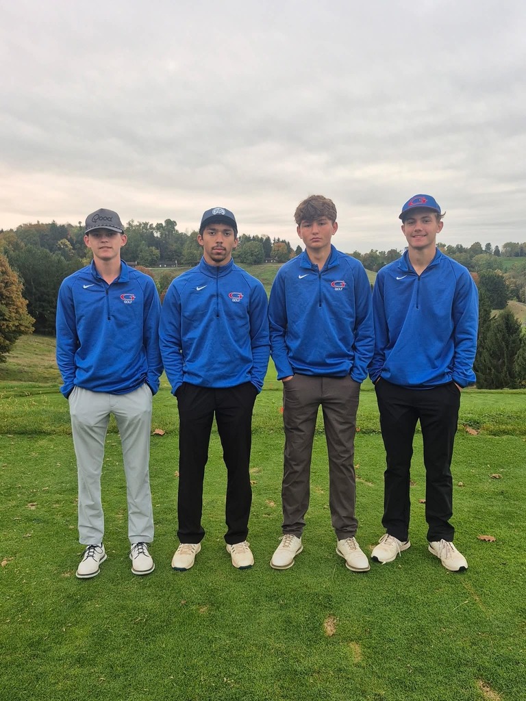 golfers standing on the course
