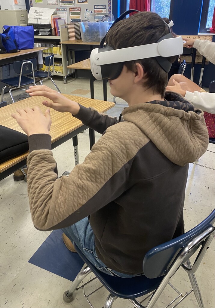 student with vr headset