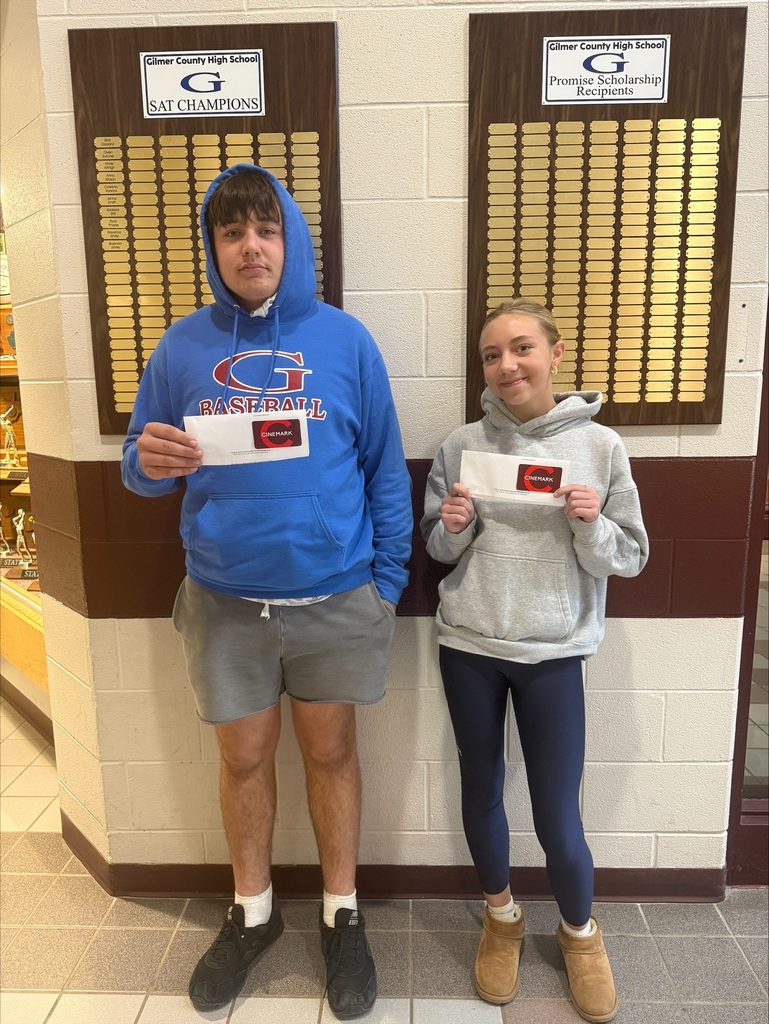 two students receiving gift card