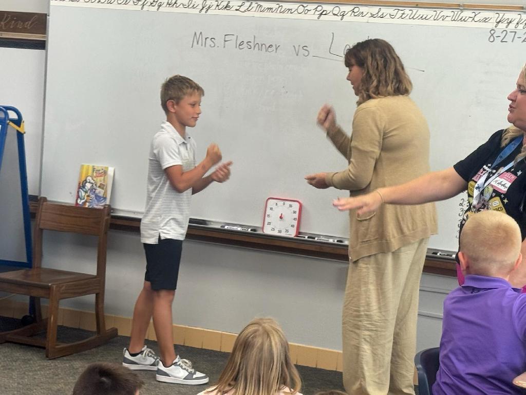 Mrs. Fleshner beat Mrs. Anderson so she took on the student winner of 3rd grade!