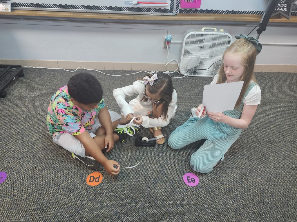 Groups of 3 worked to make the longest paper chain using 3 things-a piece of paper, tape and a pair of scissors.
