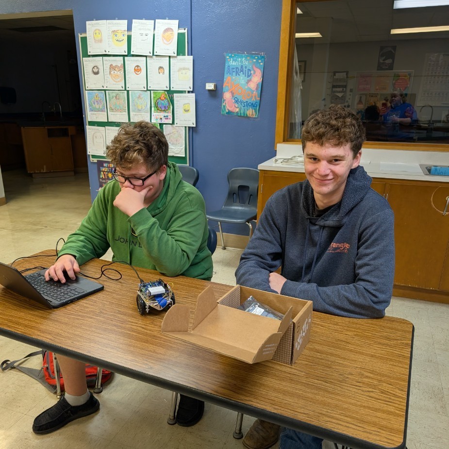 Layne and Aiden working on the code.
